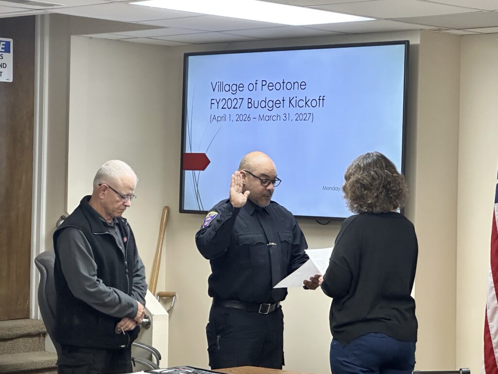 New part-time police officer Oscar Galarza was sworn in at the December 15 Peotone Village board meeting-photo by Andrea Arens.