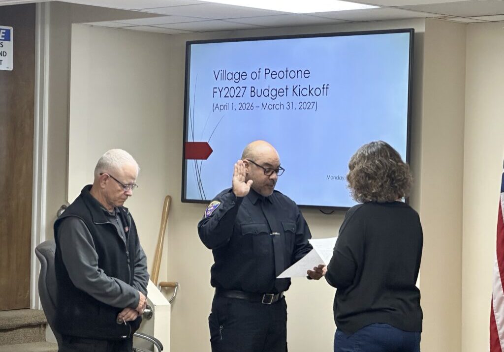 New part-time police officer Oscar Galarza was sworn in at the December 15 Peotone Village board meeting-photo by Andrea Arens.