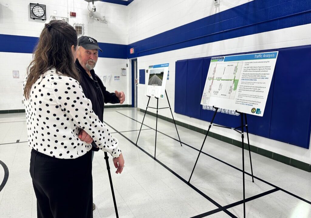 Emily Anderson of CBBEL speaks with a concerned resident at the WCDOT Open House on March 19-photo by Andrea Arens